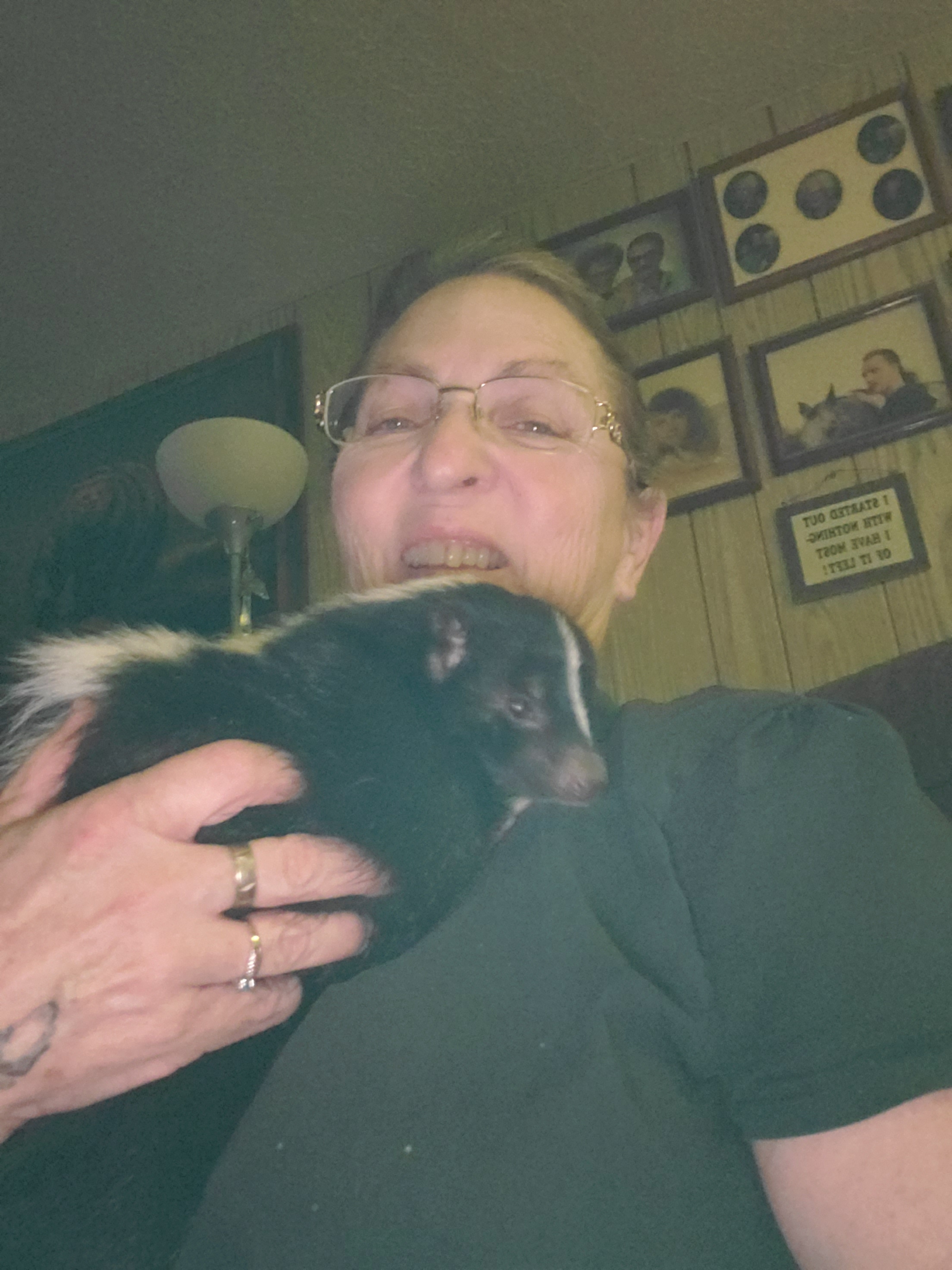Photo of Cam Segal and one of her skunks